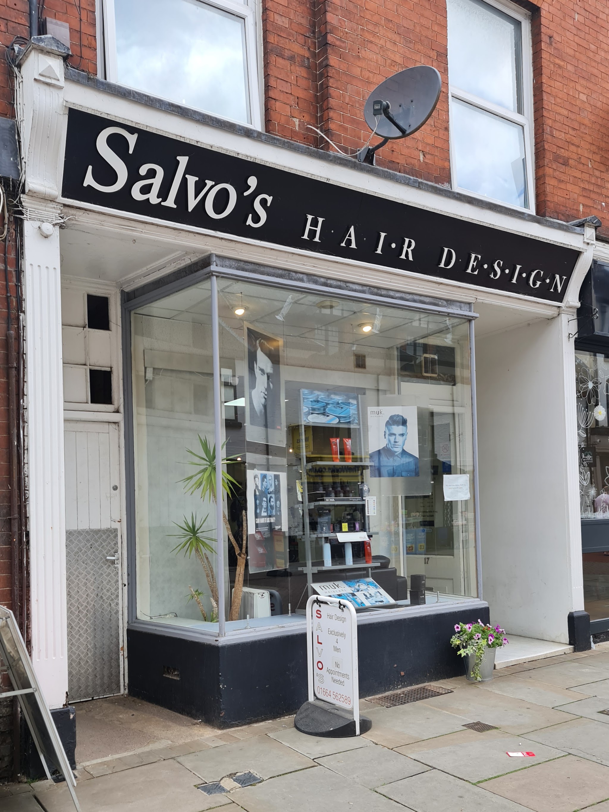 Salvo's Hair Design from across Nottingham Street, with the A-board on the pavement